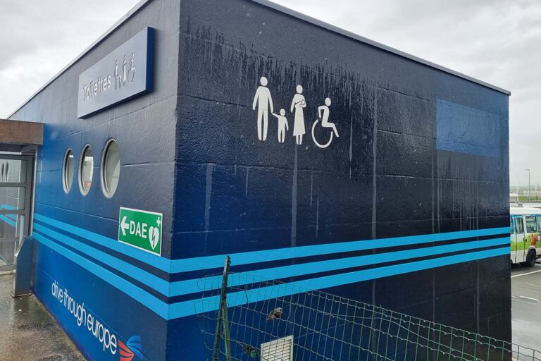 Blue restroom building at the Eurotunnel.